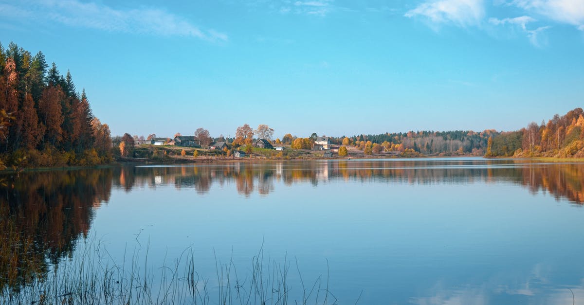 2 cubes collide and fall in water, how to get one? - Lake Near Trees Under Blue Sky