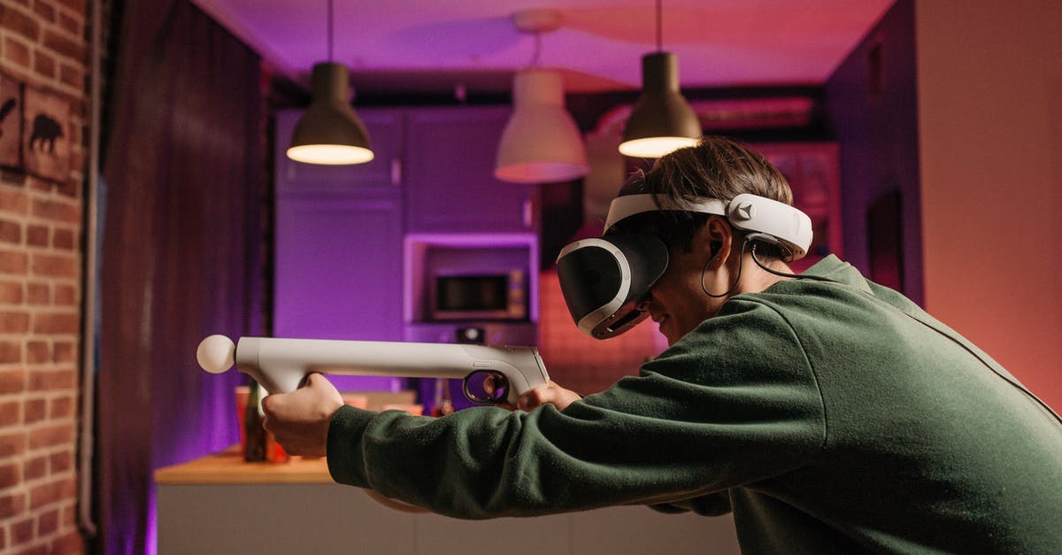 360 controller sticking in 3rd person view - A Person Playing a Video Game using an Aim Controller