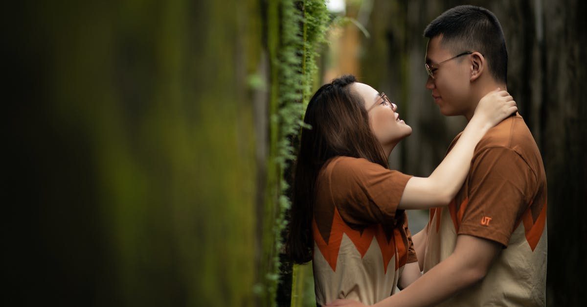 'affected by Lycanthrophy' (BMC) is functionally the same as 'appear as wolfpack to Seer'? - Loving couple embracing near wall with moss