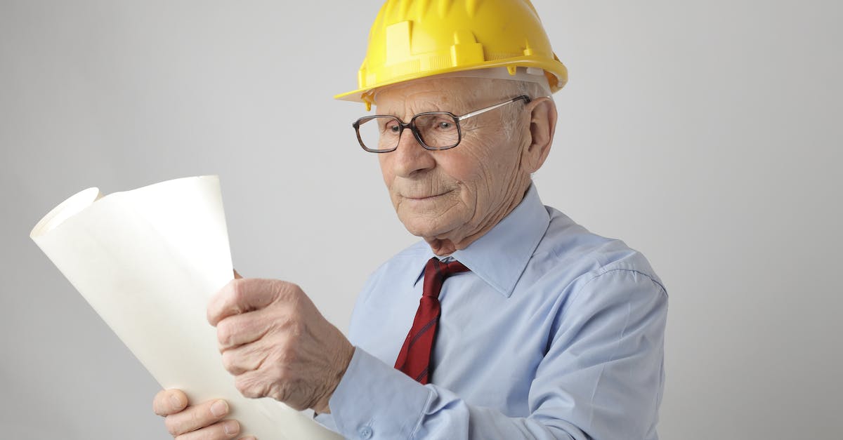 'Clay Pigeon Shooting' Achievement not progressing - Senior male engineer reading blueprint in studio