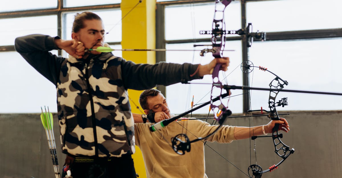 'Radio Location' skill vs. white 'Located' arrow - Man in Black and White Jacket Holding Black Rope 'Radio Location' skill vs. white 'Located' arrow - Man in Black and White Jacket Holding Black Rope