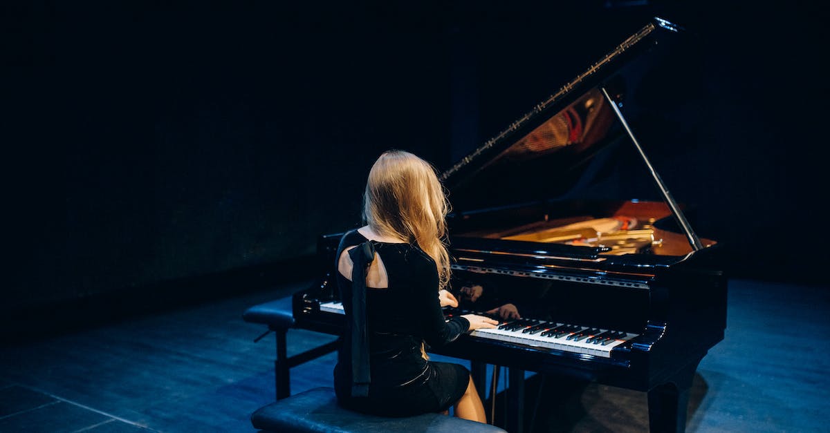 3 stage evolution pokemon vs 2 stage evolution pokemon - Woman in Black Long Sleeve Shirt Playing Piano