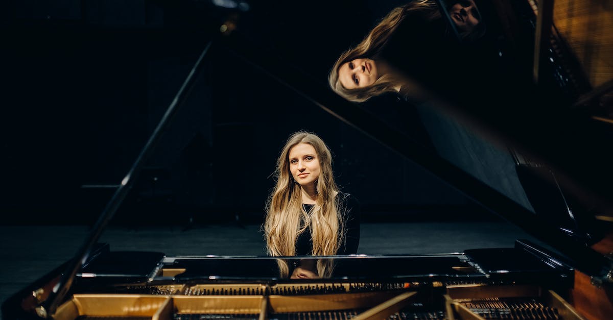3 stage evolution pokemon vs 2 stage evolution pokemon - Woman in Black Shirt Standing Beside Brown Wooden Table