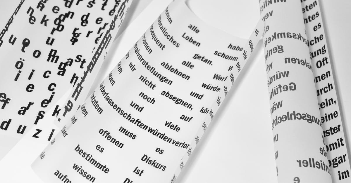 A 'native text' file appears on my desktop whenever I launch Minecraft [duplicate] - From above of rolled sheets of paper with inscriptions written in German language placed on white background in light room