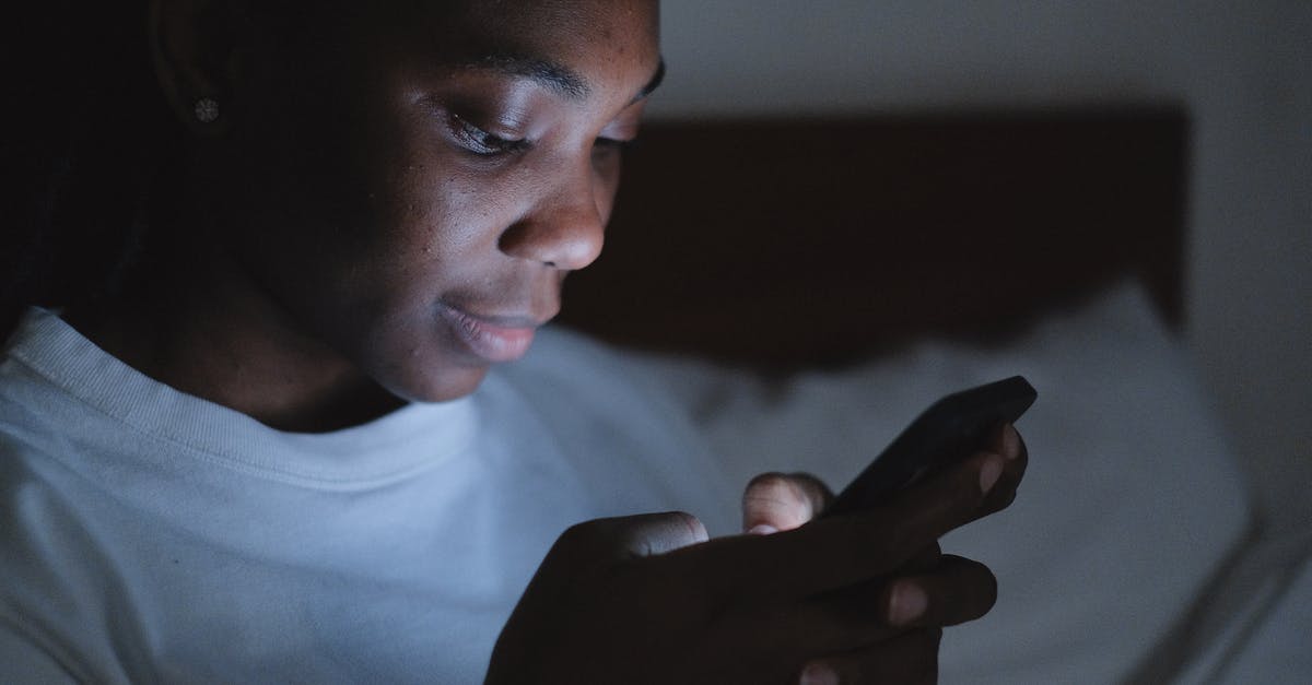 A Dark Room didn't autosave? - Woman Using Her Phone in the Dark Room A Dark Room didn't autosave? - Woman Using Her Phone in the Dark Room