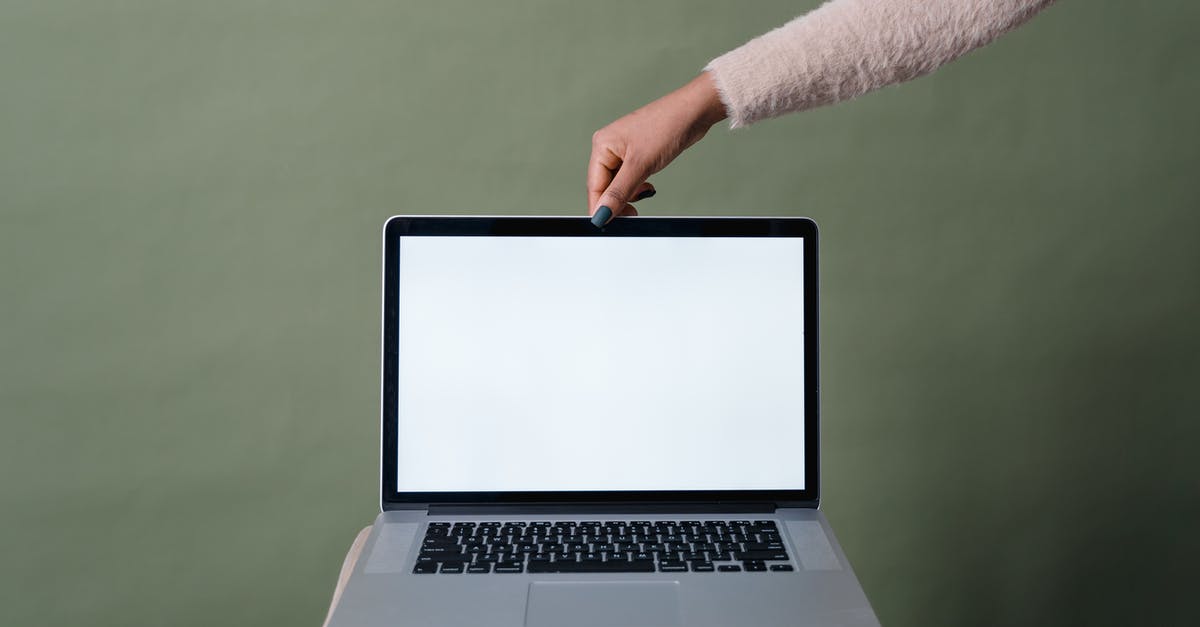 A Minecraft PE mod is asking me if my device is 'rooted'. What does this mean? [closed] - Close-Up Shot of a Person Holding a Laptop