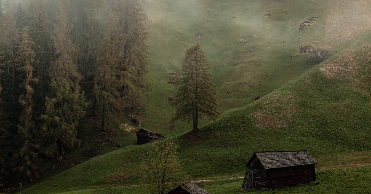Abandoned village to Village - Old wooden barns on green hill