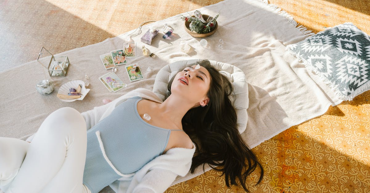 Abigail from Murdered Soul Suspect - Serene Asian woman lying with chakra stone on chest