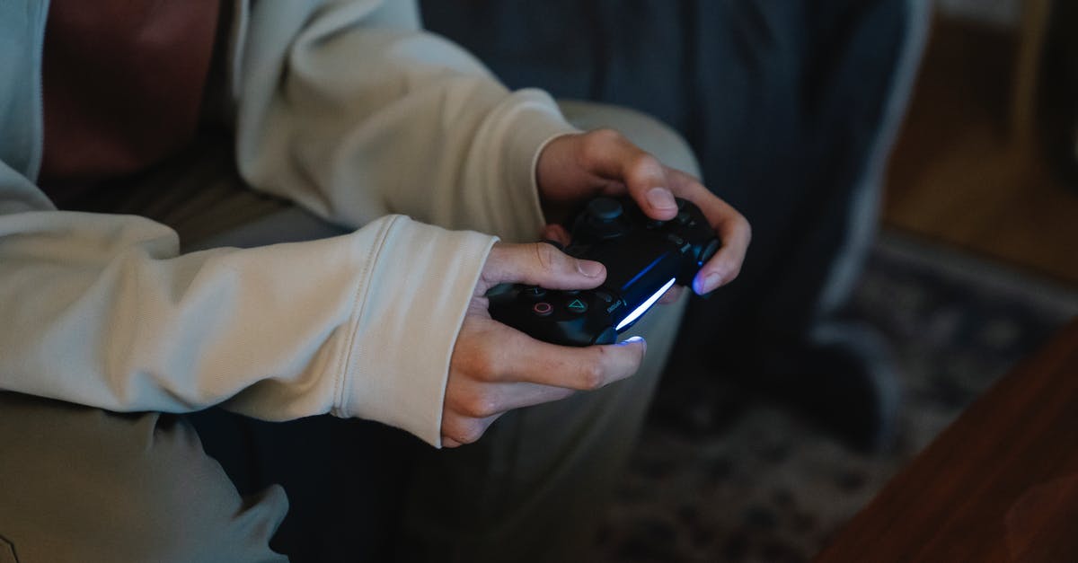 Accedently pressed Verify integrety of game cache and it deleted all my files in terraria how can I recover them. - Crop unrecognizable man with joystick playing video game while sitting on couch in house room