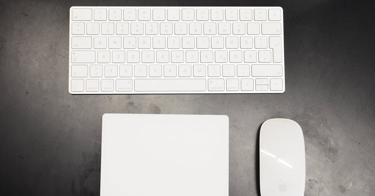 Additional mouse buttons do not work with CS:GO - Top view of modern wireless white keyboard and mouse with pad placed on black table