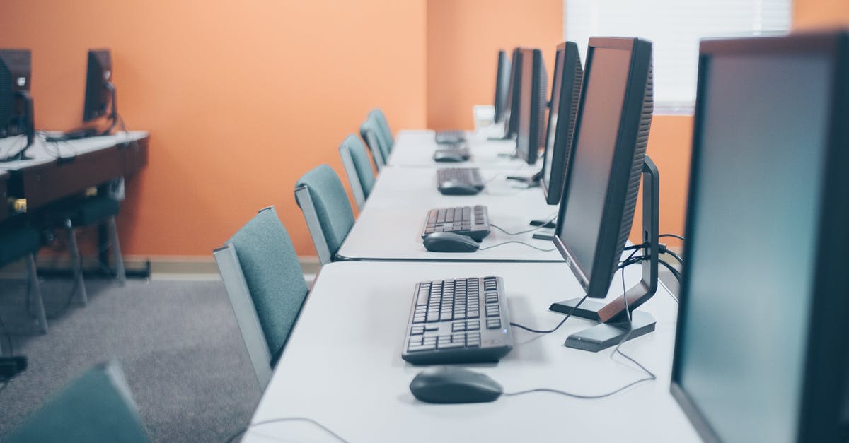 Additional mouse buttons do not work with CS:GO - Modern office with desktop computers and keyboards