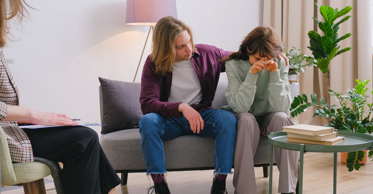 Advice on banning champs? [closed] - Young male embracing frustrated girlfriend during session with psychologist in light room in daytime