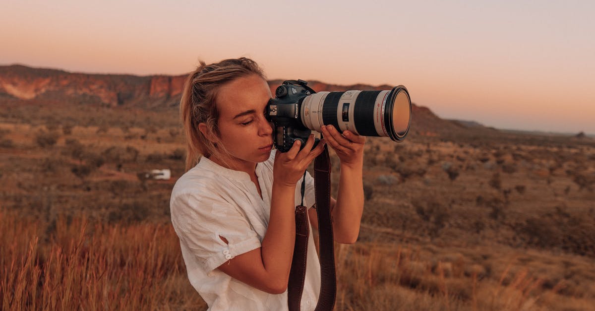 Aether lens for Blink dagger - Woman in White Shirt Holding Black Dslr Camera Aether lens for Blink dagger - Woman in White Shirt Holding Black Dslr Camera