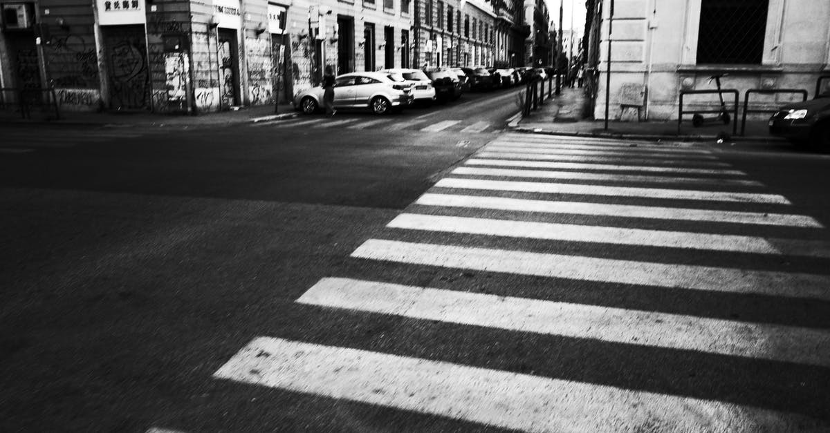 After a time playing, the cars lose the exterior of the chasis - Grayscale Photo of Pedestrian Line After a time playing, the cars lose the exterior of the chasis - Grayscale Photo of Pedestrian Line