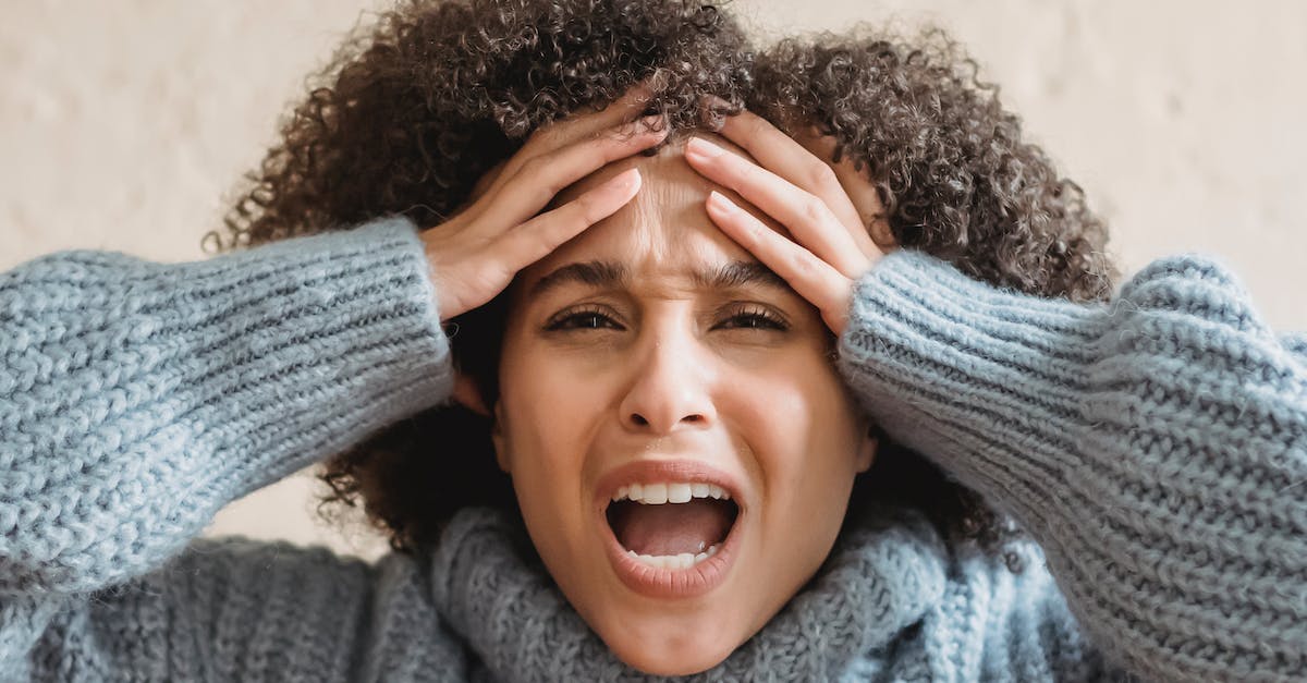 Aggressive enderman tag with /summon? - Expressive African American woman with curly brown hair touching head and yelling against light background