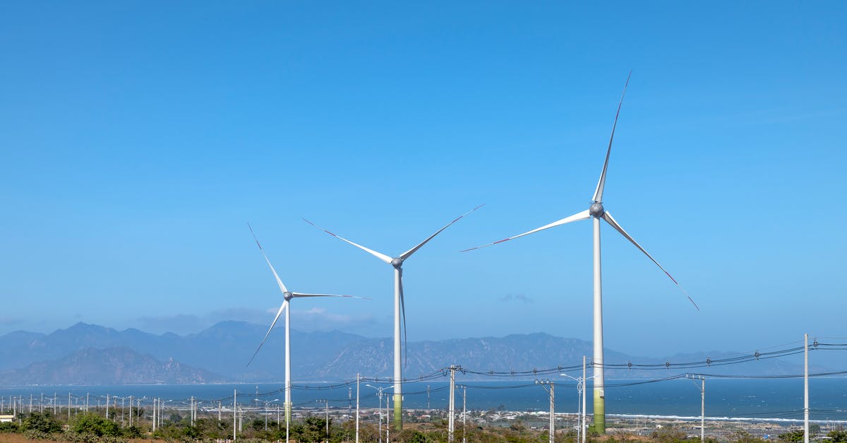 Alternative source for Vertibird Signal Grenades? - Scenery view of wind turbines in row on terrain with plants against ocean and mounts in daytime