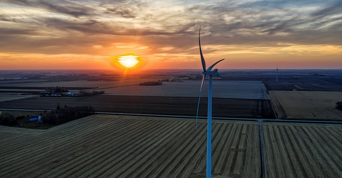 Alternative way for the torture chamber? - Wind Turbine on Brown Wooden Dock during Sunset