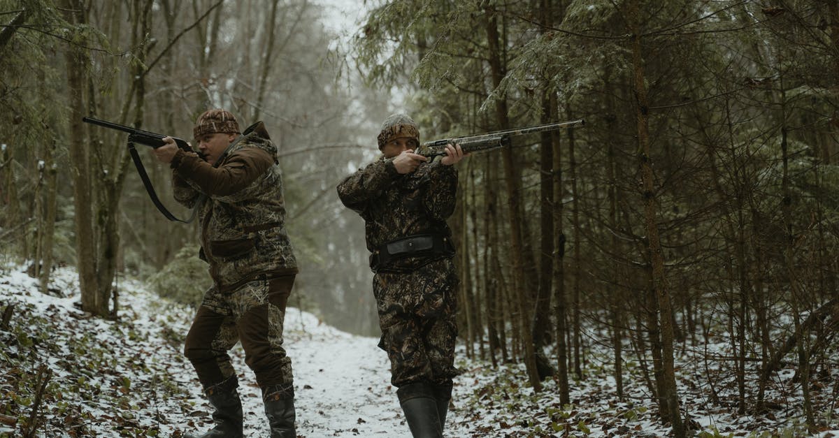 Ammo Conservation for Plasma Weapons - Two Men Standing in the Woods Aiming Their Rifles Ammo Conservation for Plasma Weapons - Two Men Standing in the Woods Aiming Their Rifles