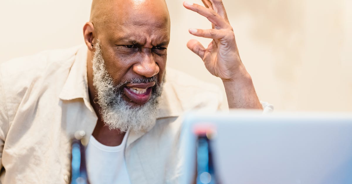 Angry Wolves on Demand! - Man in White Crew Neck Shirt Holding Blue Pen