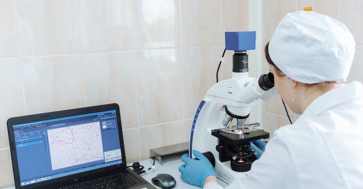 Anno 2070 Sunken Research Labs - Man in White Dress Shirt Using Macbook Pro