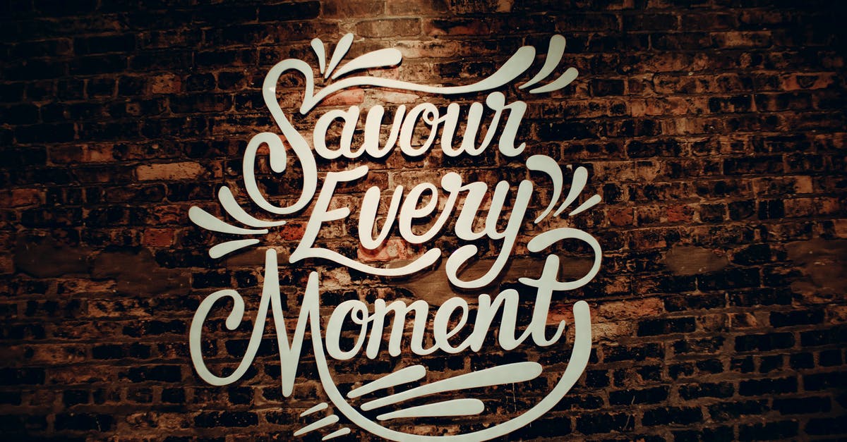 Announcer no longer announces every kill - White creative signboard with Savour Every Moment inscription with decorative elements hanging on shabby brown brick wall of contemporary cafeteria