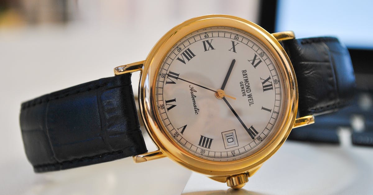 Anti-Chamber timer has an hour and five minutes remaining [duplicate] - Round Gold-colored Analog Watch With Black Leather Strap at 10:10