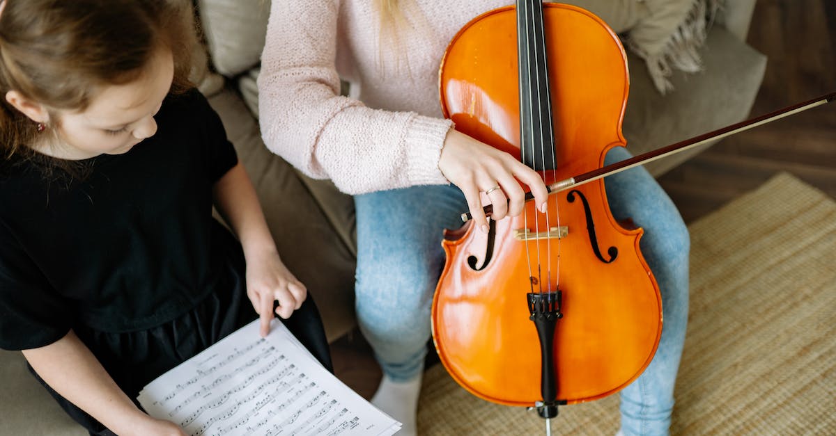 Any conflicts with DLC from a Dutch PSN account when playing a UK PS3 version of South Park: Stick of Truth? - A Young Girl in Black Dress Holding a Musical Notes while Sitting Beside a Person Playing Cello