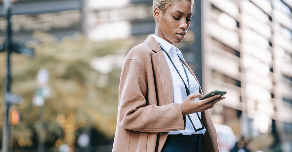Any free codes to rollback Europa Universalis 4 and other Paradox games without using their official forum? - Focused black businesswoman browsing smartphone on urban street Any free codes to rollback Europa Universalis 4 and other Paradox games without using their official forum? - Focused black businesswoman browsing smartphone on urban street