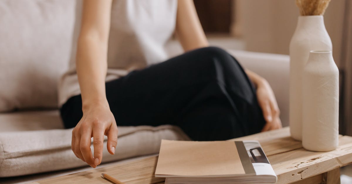 Any perks to getting 100% on Assassins Creed 4? - A Woman in White Shirt and Black Pants Sitting on Sofa