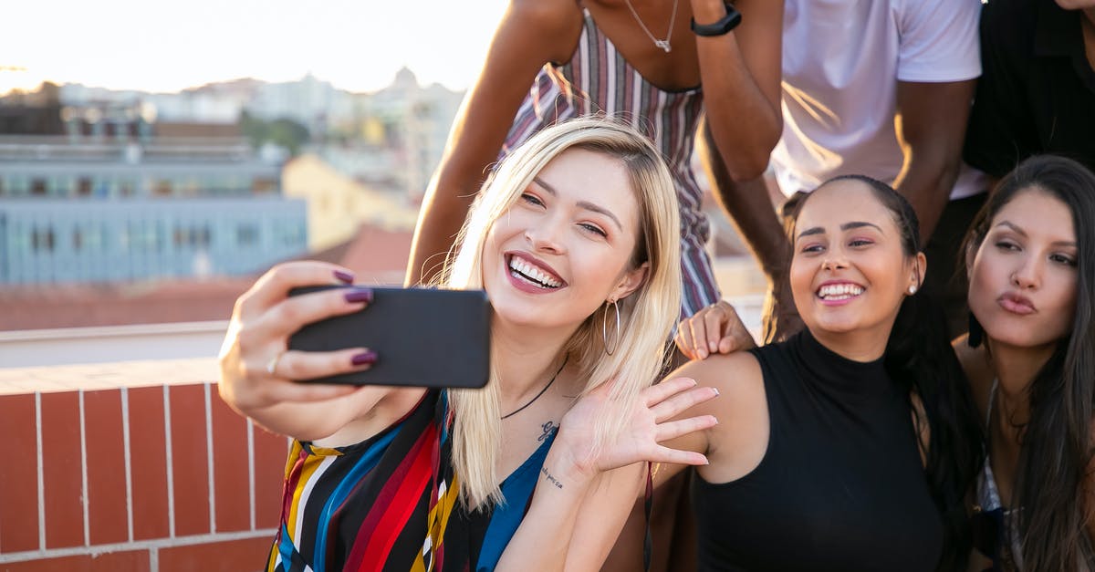 Any use to building up relationship with non party members? - Joyful young diverse millennials taking selfie during party in sunlight Any use to building up relationship with non party members? - Joyful young diverse millennials taking selfie during party in sunlight
