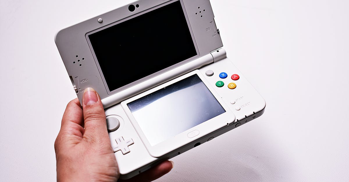 Anyone got "New" 3DS default files? - Person Holding Gray Nintendo Gameboy Advance