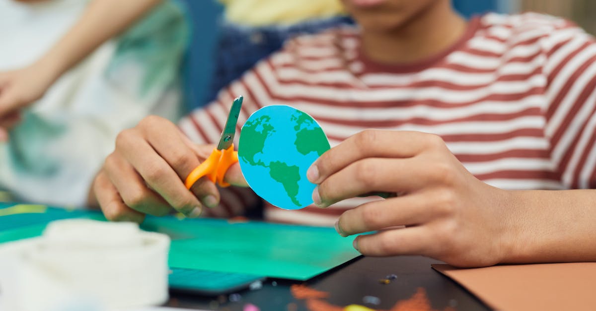 Anywhere to sit inside the Earth Temple? - Crop boy making paper craft