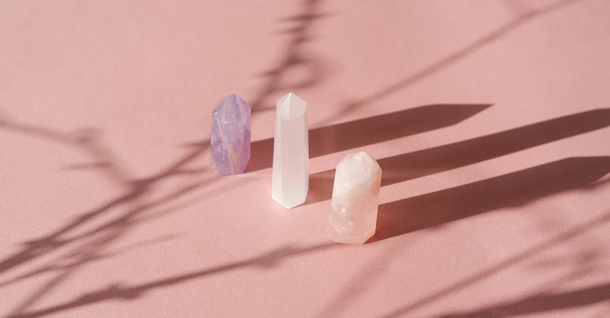 Arcane and Fire/Bolt Gems - Stone Crystals Casting a Shadow on the White Surface