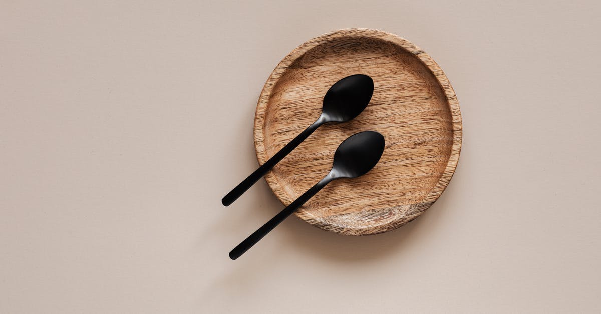 Are all agents identical except for their abilities? - Top view of composition of round wooden plate with smooth surface and similar black metal spoons on beige surface Are all agents identical except for their abilities? - Top view of composition of round wooden plate with smooth surface and similar black metal spoons on beige surface