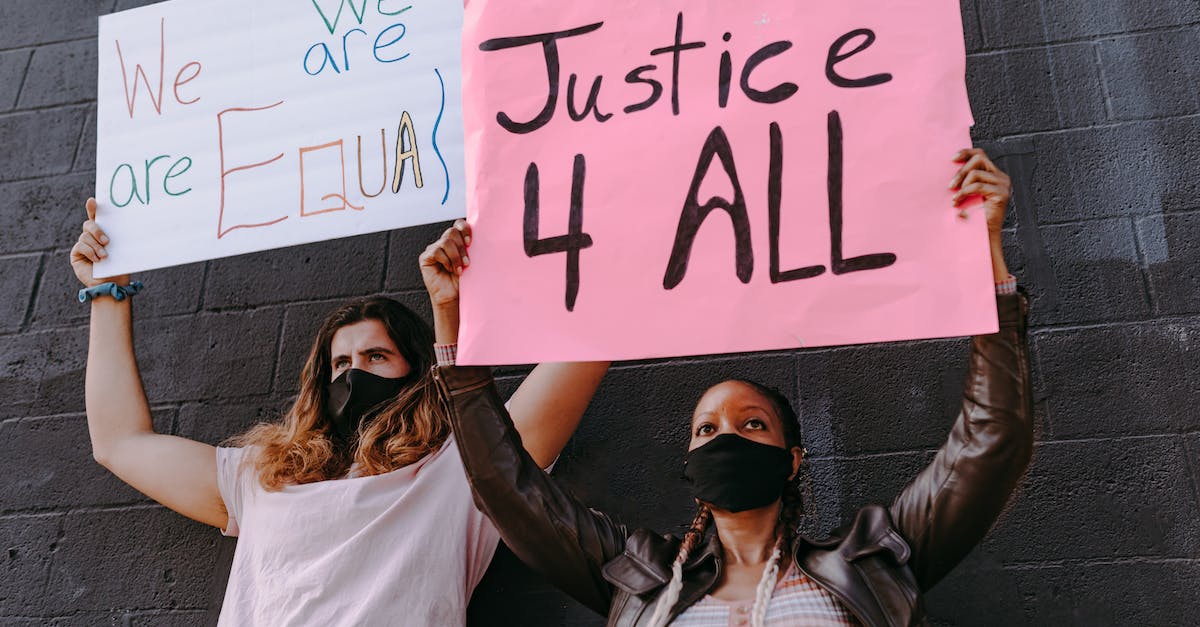 Are all bots created equal? - A Man and Woman Wearing Face Mask Holding Banners Are all bots created equal? - A Man and Woman Wearing Face Mask Holding Banners