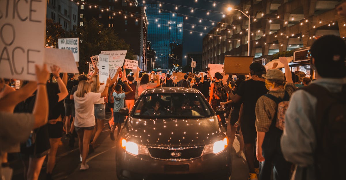 Are all cars completely equal in regard to gameplay? - Modern car with glowing headlights riding on street amidst crowd of faceless people walking together during protest at night Are all cars completely equal in regard to gameplay? - Modern car with glowing headlights riding on street amidst crowd of faceless people walking together during protest at night