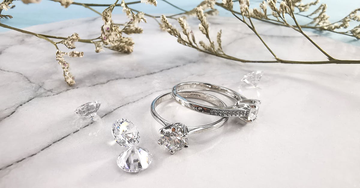 Are all glitches from the original games still present on the NES Classic Mini? - Pair of expensive engagement rings and shiny diamonds placed on marble table near natural plant twigs