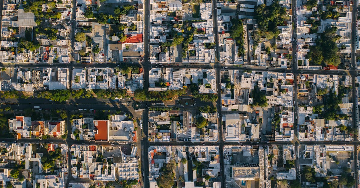 Are buildings currently being upgraded able to function during clan war? - Aerial View of City Buildings
