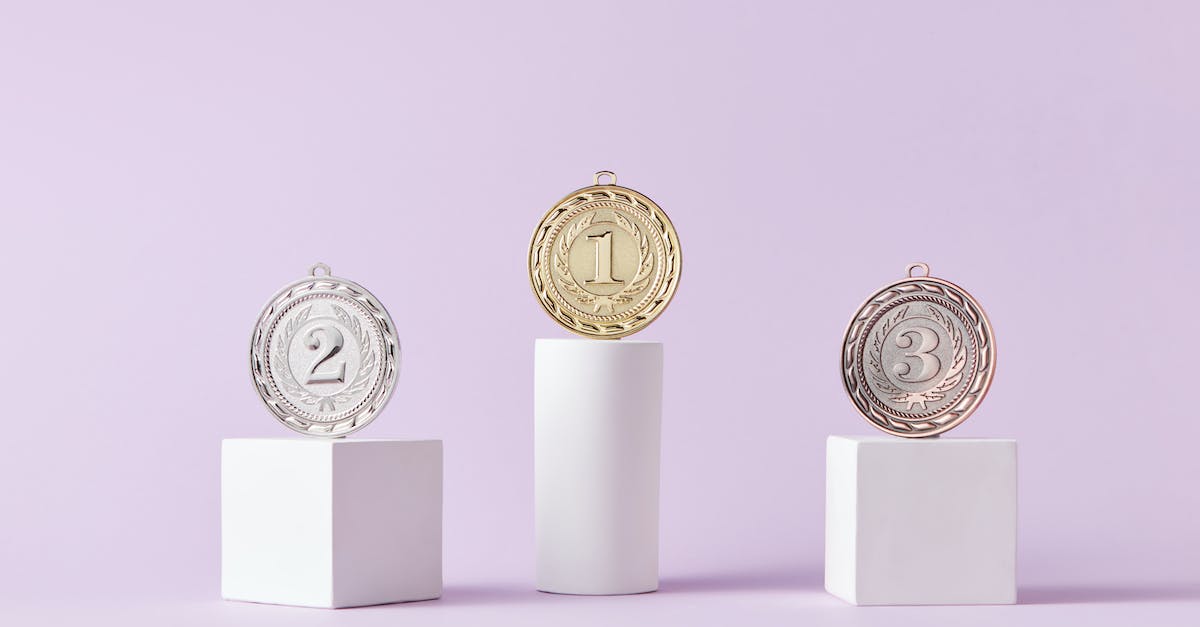 Are coins awarded between races in a Grand Prix? - Medals on Pedestal on Pink Studio Background Are coins awarded between races in a Grand Prix? - Medals on Pedestal on Pink Studio Background