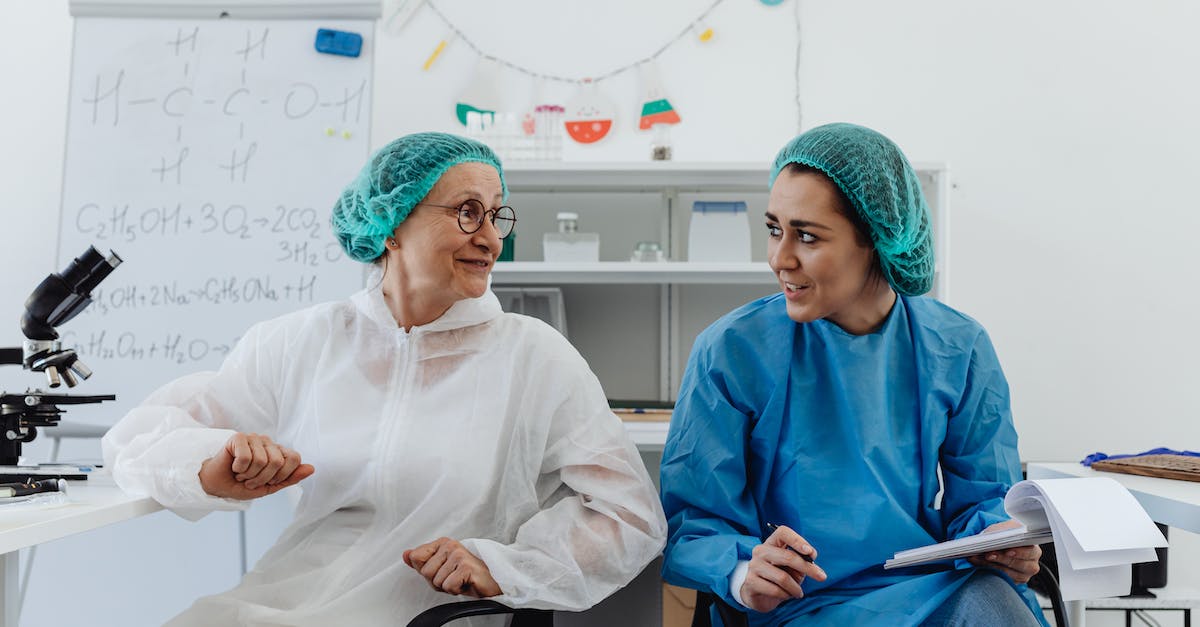 Are donated clan troops affected by laboratory upgrades of the donor or recipient? - Woman in White Long Sleeve Shirt and Green Hijab Sitting on Black Chair