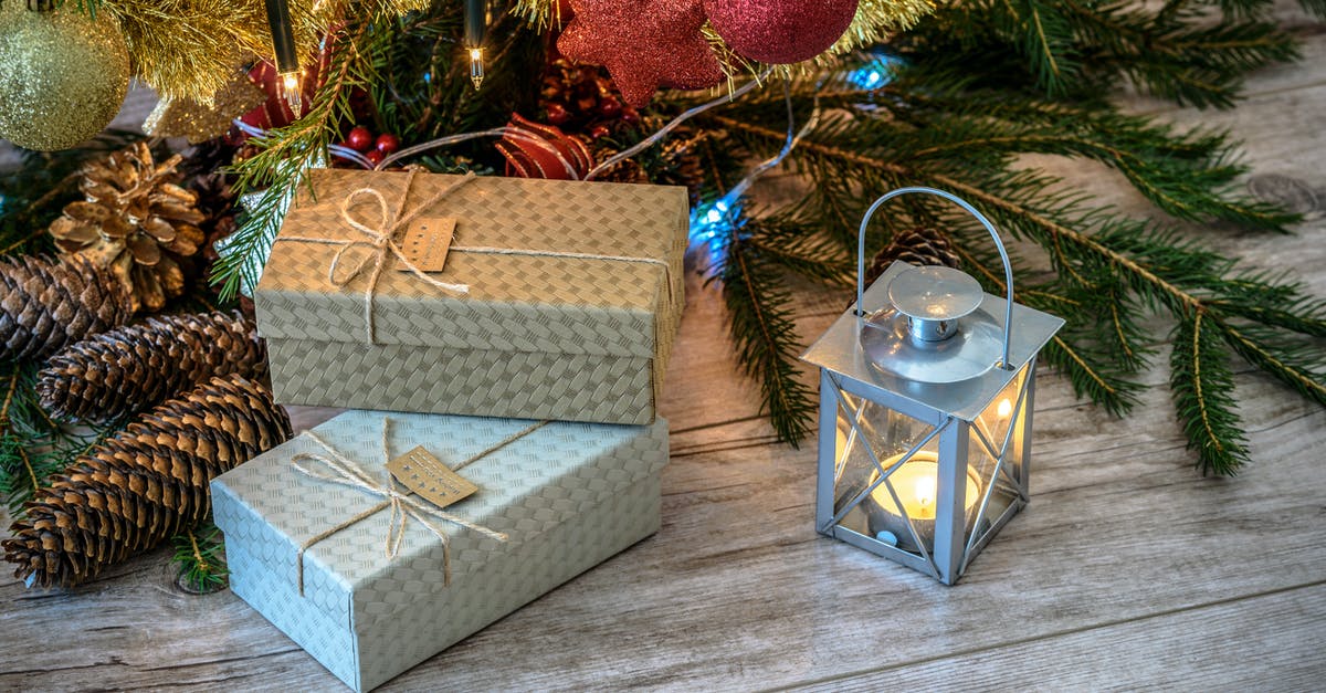 Are golden cards counted when mass disenchanted? If so, are they or the normal versions disenchanted first? - Lit Candle Inside Lantern Beside Gift Boxes and Christmas Tree