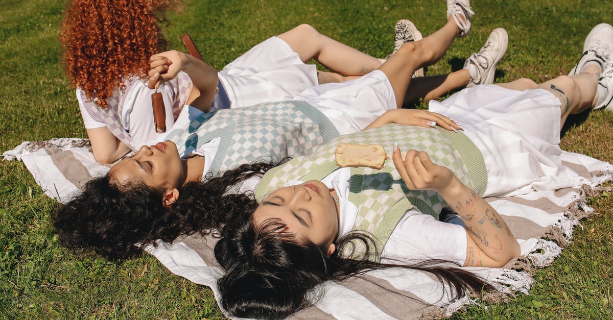 Are my friends immune to the harmful effects of radiation? - Woman Lying on Green Grass Field