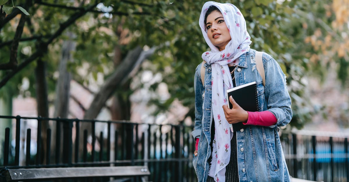 Are pedestrian walkways purely cosmetic, or do they help encourage walking instead of driving? - Worried ethnic woman walking along park with planner