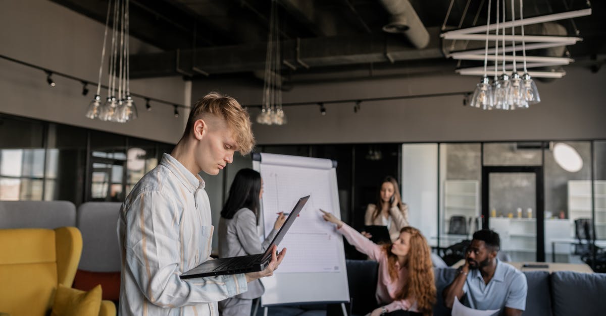 Are powerplay points shared with wingmates? - Group of multiracial coworkers using gadgets and discussing project in office Are powerplay points shared with wingmates? - Group of multiracial coworkers using gadgets and discussing project in office