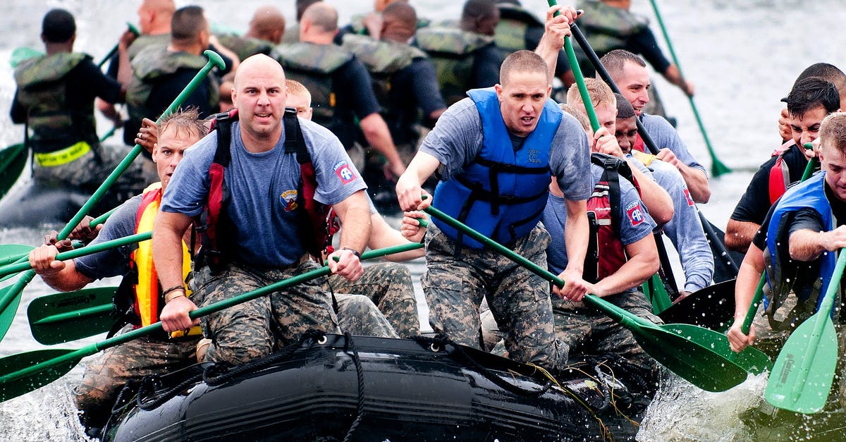 Are Roleplay Groups A Myth? - Men Paddling in Inflatable Raft Boat during Daytime