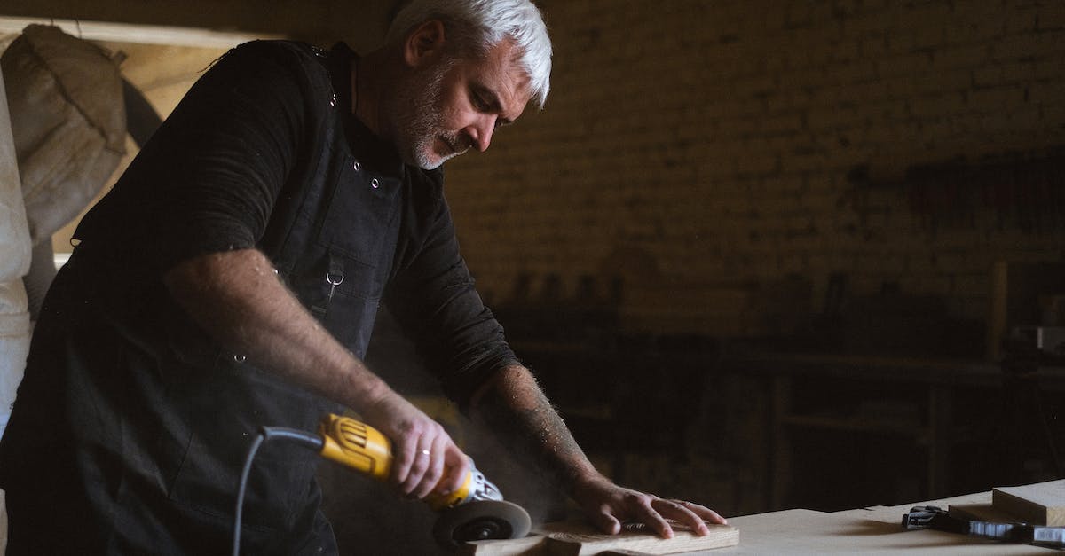 Are S.P.E.C.I.A.L. skills capped at 10? - Serious male woodworker in apron using mallet and chisel to carve wooden board at table with abundance of instruments in carpentry Are S.P.E.C.I.A.L. skills capped at 10? - Serious male woodworker in apron using mallet and chisel to carve wooden board at table with abundance of instruments in carpentry