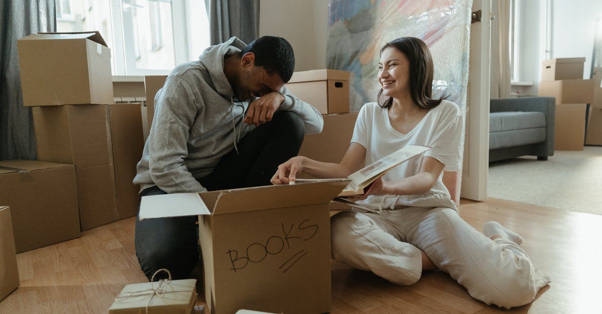 Are the quality of the Loot Boxes received based on RNG? - Man in Gray Sweater Sitting Beside Woman in Gray Sweater