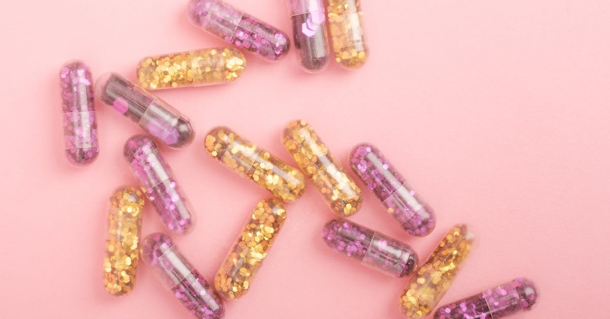 Are the Survival Pack: Recovery Items reusable on a different playthrough? - Pile of sparkling drug capsules scattered on pink surface