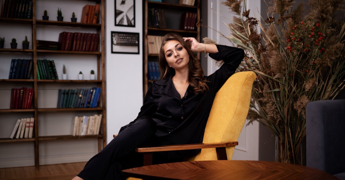 Are there any advantages to having an axe with silk touch? - Stylish woman in black clothes sitting gracefully on armchair