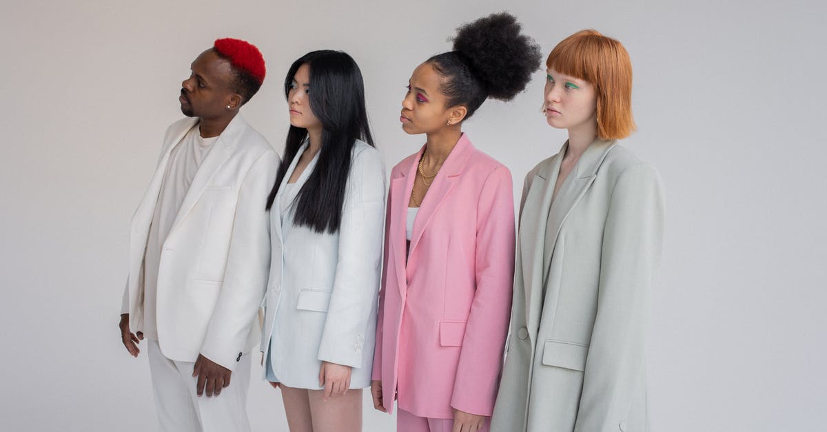 Are there any different endings to Emily Is Away? - Multiethnic female models and man wearing elegant outfits standing in line against gray background and looking away with attention Are there any different endings to Emily Is Away? - Multiethnic female models and man wearing elegant outfits standing in line against gray background and looking away with attention